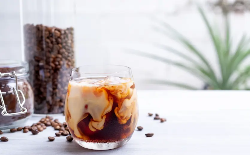Cold brew with milk with coffee beans.