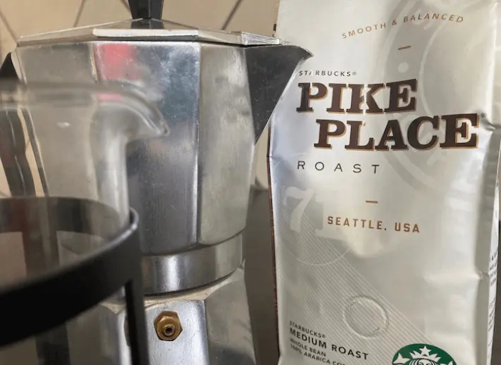 Pike Place Espresso Beans in packet with moka pot and French press.