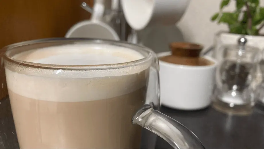 Vanilla latte in glass mug.