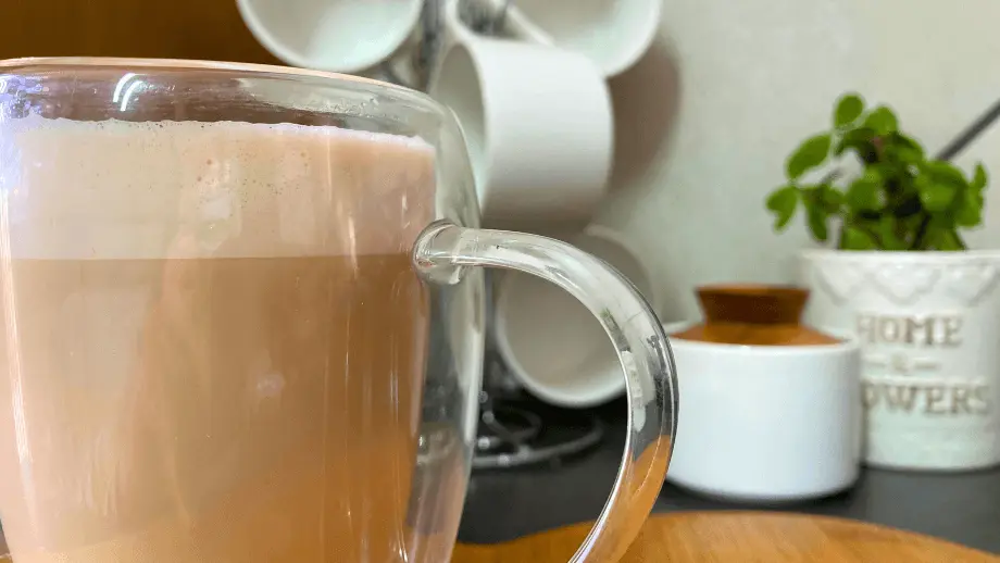 Latte in double walled mug.