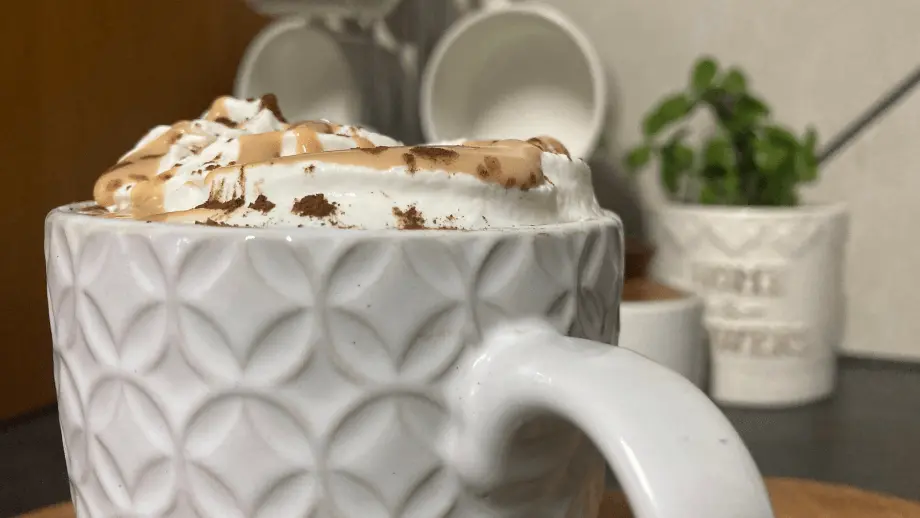 Caramel mocha latte in textured mug.