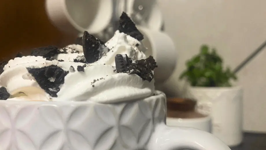 Cookies and cream condensed milk coffee in a textured mug.