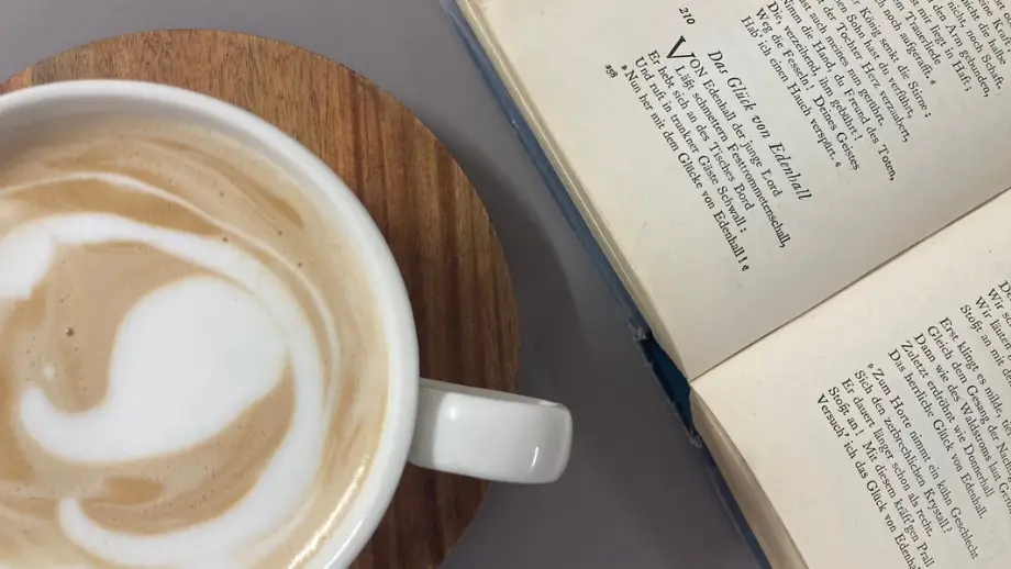 Latte and an open book.