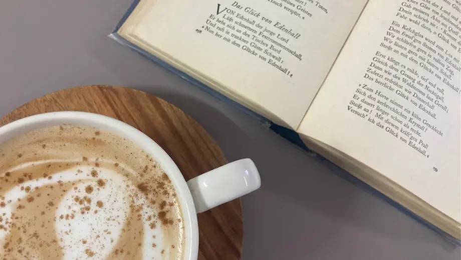 Ginger latte next to book.