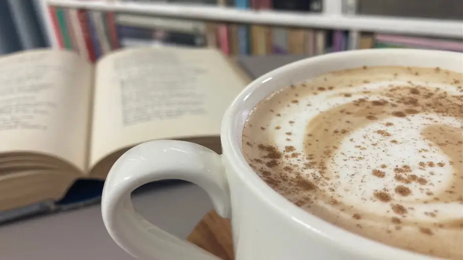 Ginger latte in front of book.