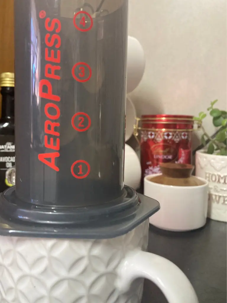 AeroPress on white textured mug