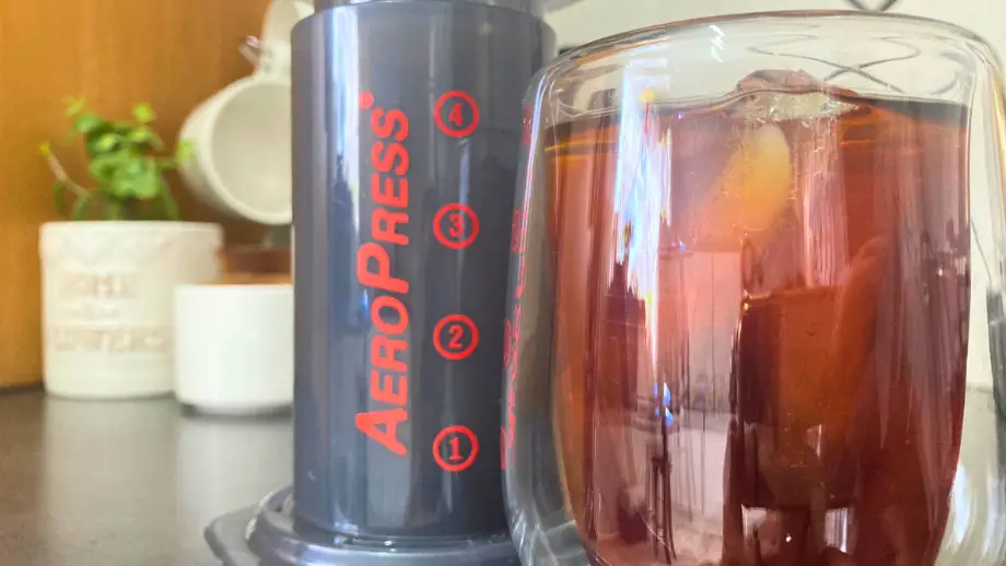 Cold brew in a double walled glass and an AeroPress.