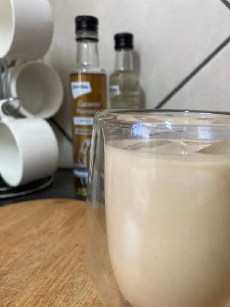 Caramel iced coffee in a double walled glass