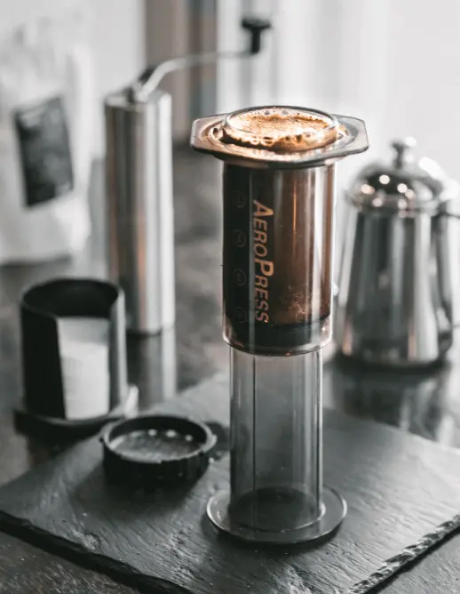 AeroPress with coffee that is brewing in.