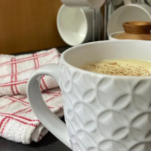 Eggnog latte in textured mug.