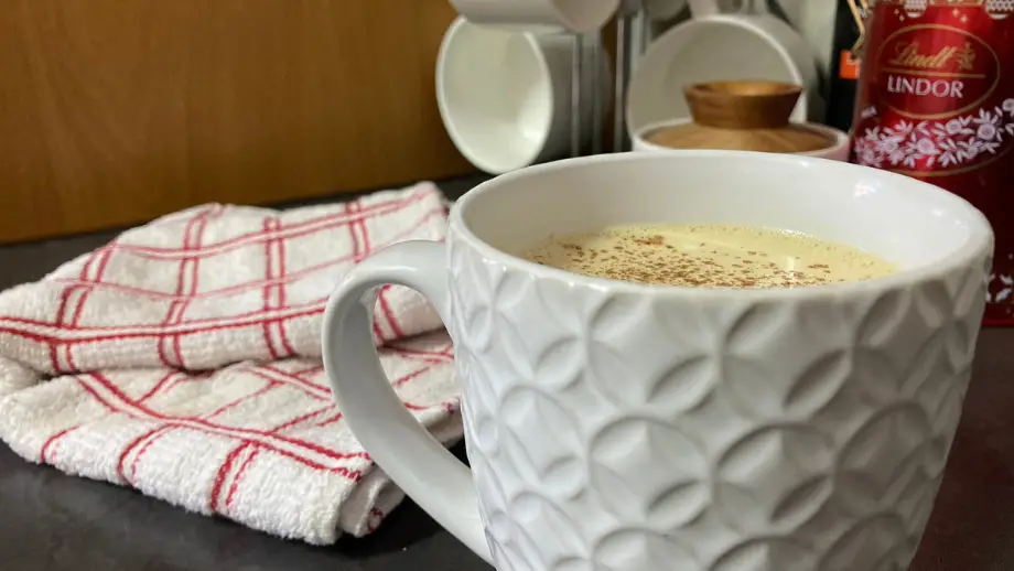 Eggnog latte in textured mug.