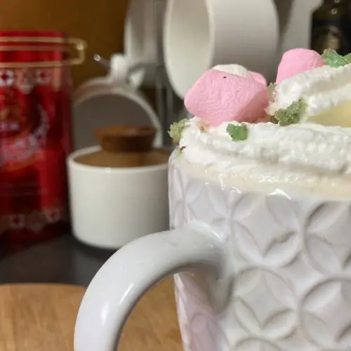 Peppermint marshmallow latte in textured white mug.