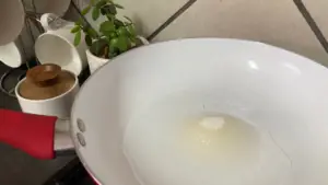 Water and sugar in a frying pan.
