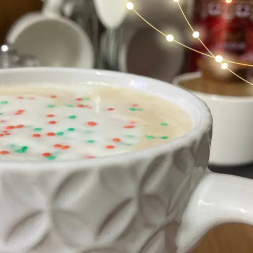 Sugar cookie latte in textured white mug.