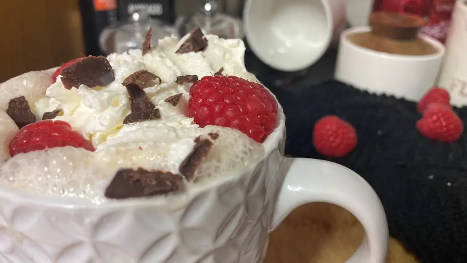 Raspberry mocha with whipped cream and chocolate shavings